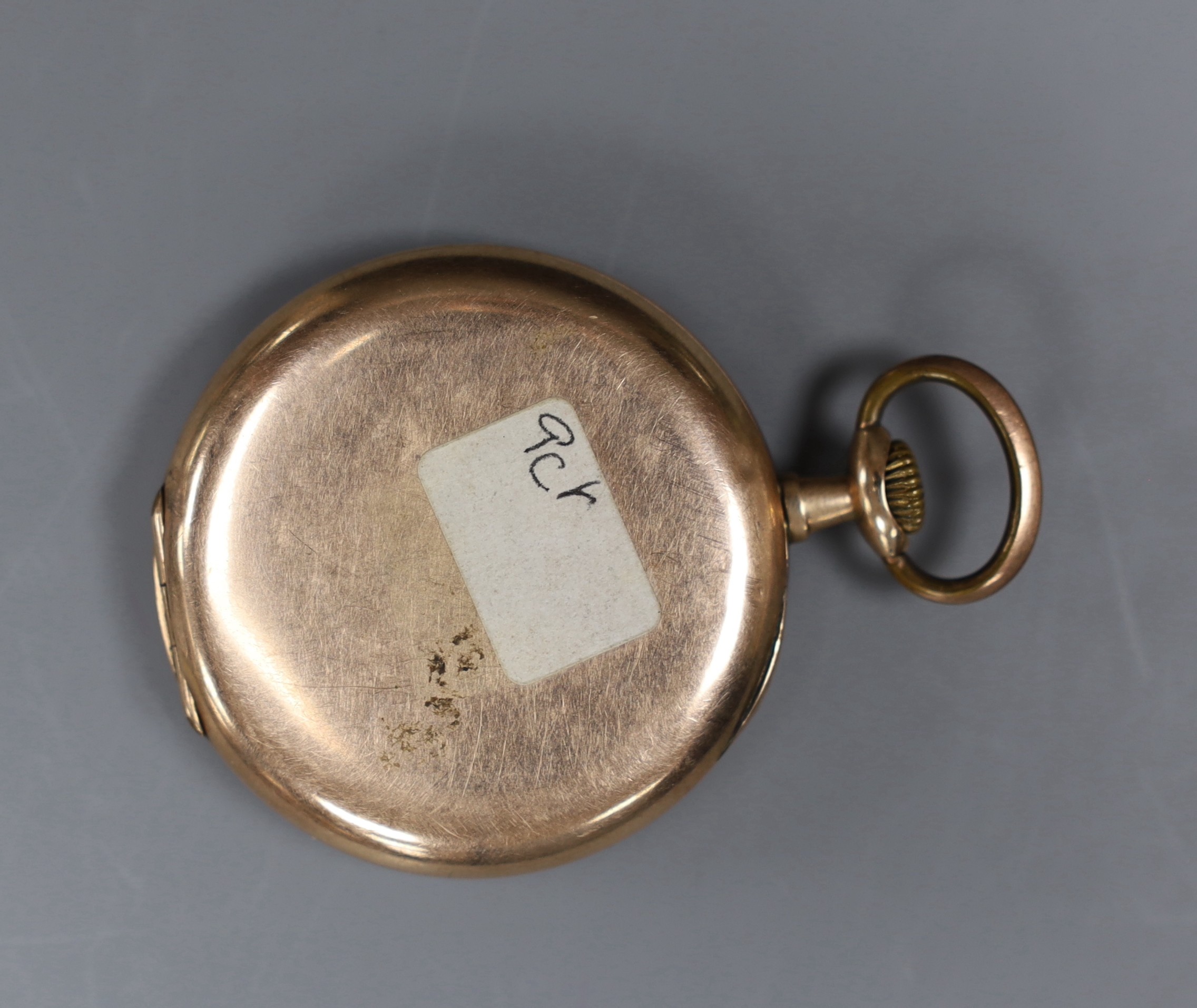 An early 20th century 9K gold keyless pocket watch, with silvered dial and unsigned movement